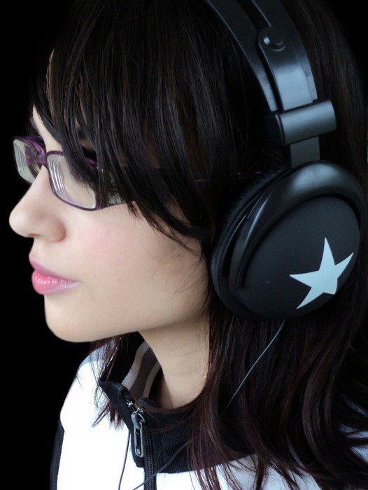 person using noise-cancelling headphones to block out distractions and increase focus